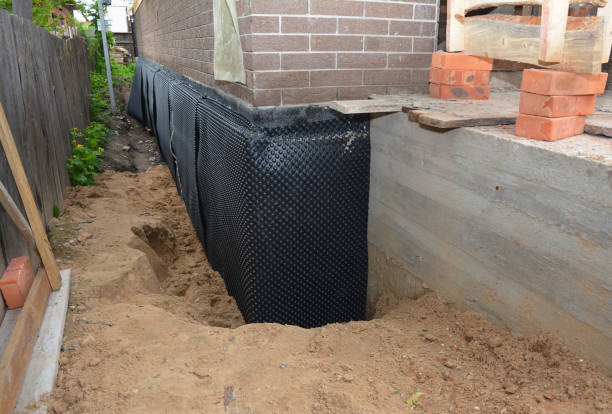 Happy homeowners after waterproofing job in Hamilton